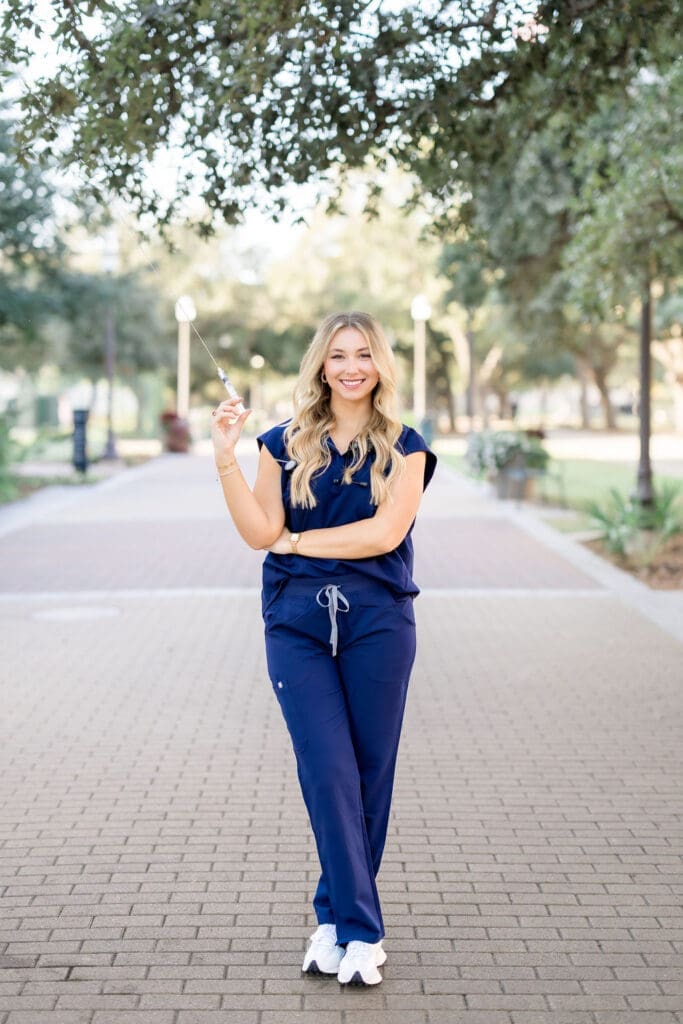 College Station photographer captures Texas A&M graduation session with nursing props