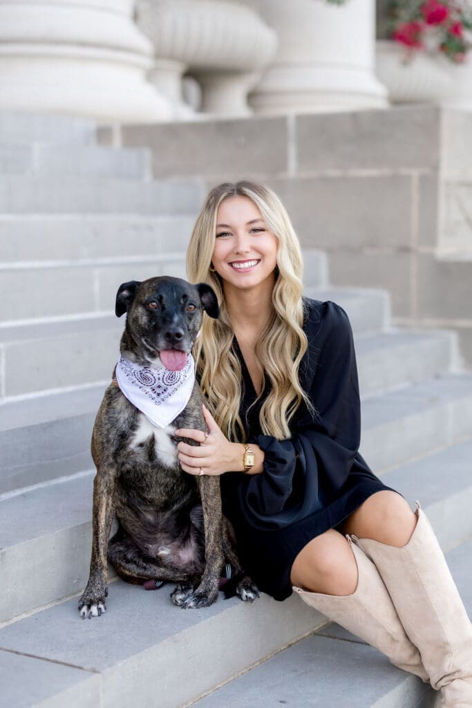 Sweet moments with dog during graduation photoshoot at Texas A&M