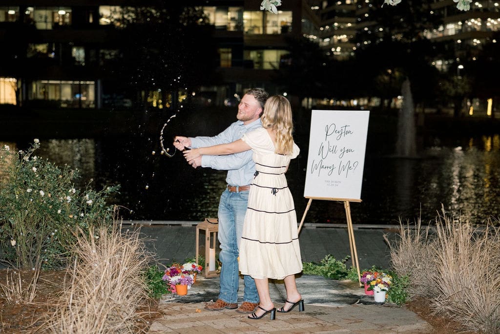 A joyful moment between the couple after surprise proposal in at Hughes Landing