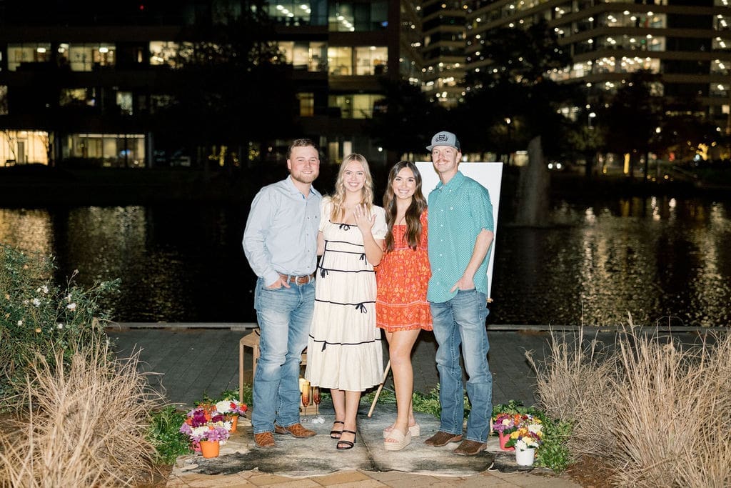 Family and friends celebrating Peyton and Tate's engagement at surprise party in The Woodlands