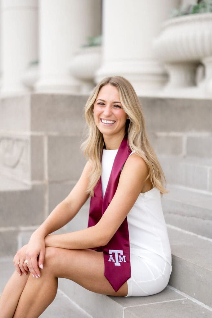 Adeline glowing in golden hour light at Texas A&M's Administration Building, capturing timeless graduation portraits