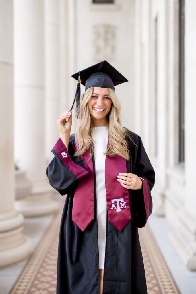 Adeline glowing in golden hour light at Texas A&M's Administration Building, capturing timeless graduation portraits