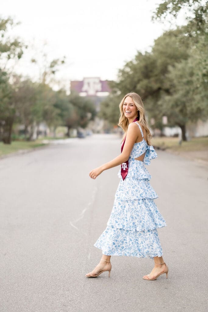 Taken by a Texas A&M Photographer in College Station, Adeline’s graduation portraits with a view of Kyle Field framed by trees, adding a personal touch to her session.