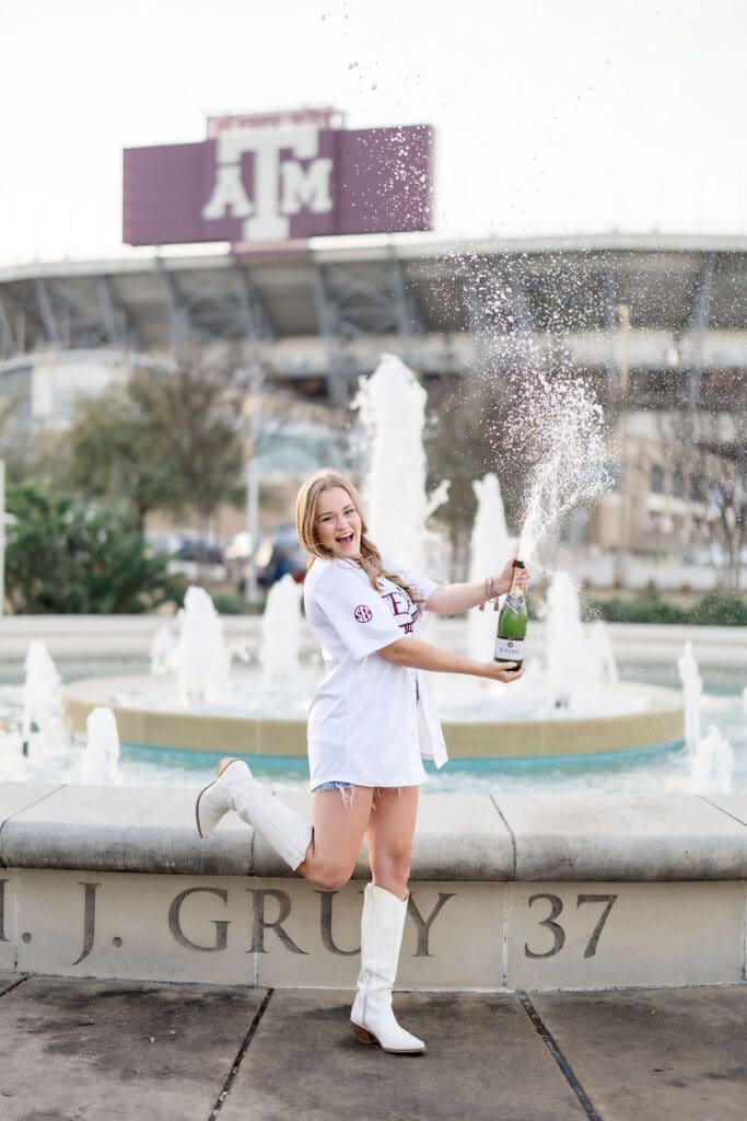 Golden-hour TAMU senior photos at the Association of Former Students Fountain featuring Grace