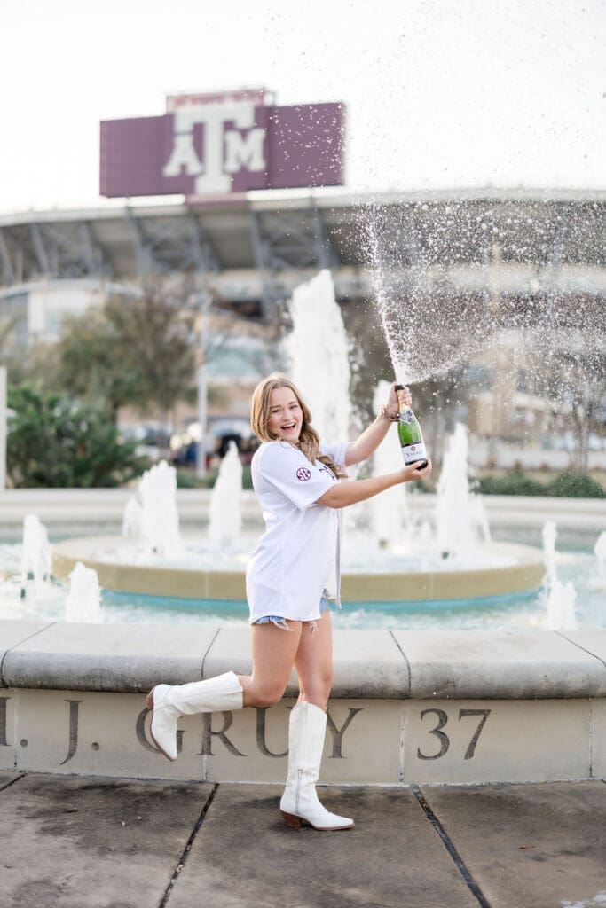 Golden-hour TAMU senior photos at the Association of Former Students Fountain featuring Grace