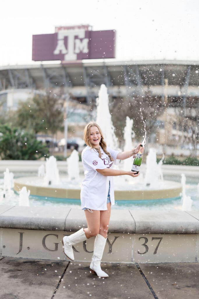 Golden-hour TAMU senior photos at the Association of Former Students Fountain featuring Grace