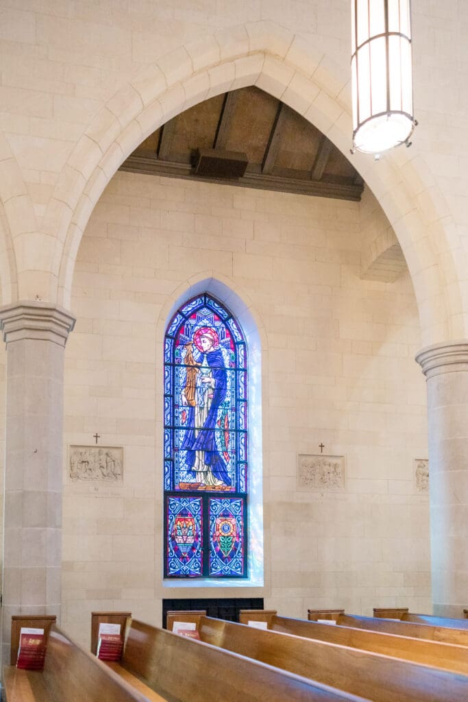 Holy Rosary Catholic Church stain glass interior during wedding ceremony in Houston, Texas