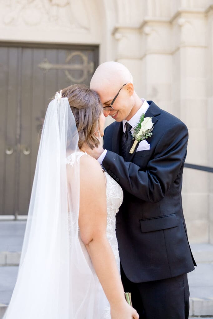 Newlywed portraits outside Holy Rosary Catholic Church in Houston, Texas