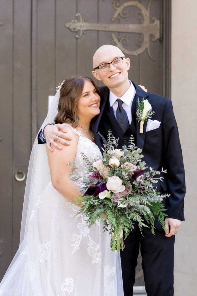 Newlywed portraits outside Holy Rosary Catholic Church in Houston, Texas