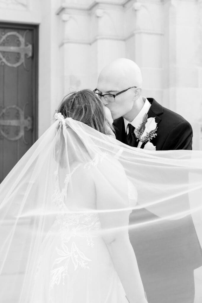 Newlywed portraits outside Holy Rosary Catholic Church in Houston, Texas