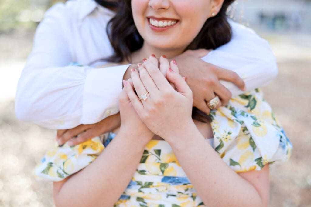 Natural light engagement portrait of couple by Texas A&M Century tree