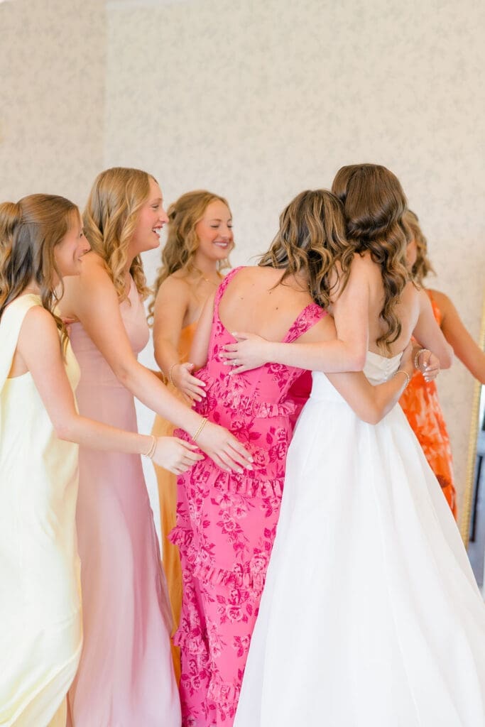 Bride getting ready in the bridal suite with her bridesmaids