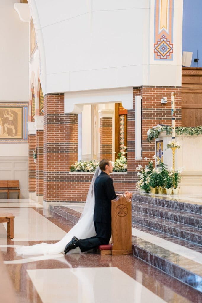 Bride and groom exchanging vows during Mass at St. Mary’s College Station