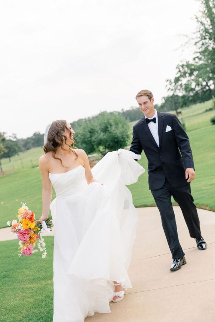 Candid reception moment at Camp Hosea captured by Catholic church wedding photographer Texas