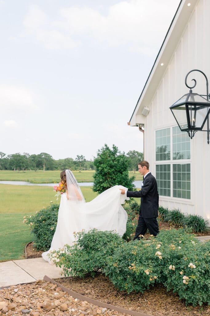 Candid reception moment at Camp Hosea captured by Catholic church wedding photographer Texas