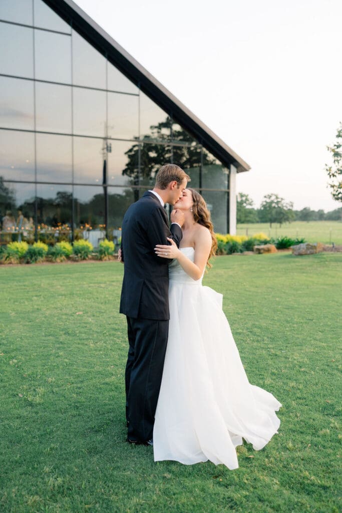 Candid reception moment at Camp Hosea captured by Catholic church wedding photographer Texas