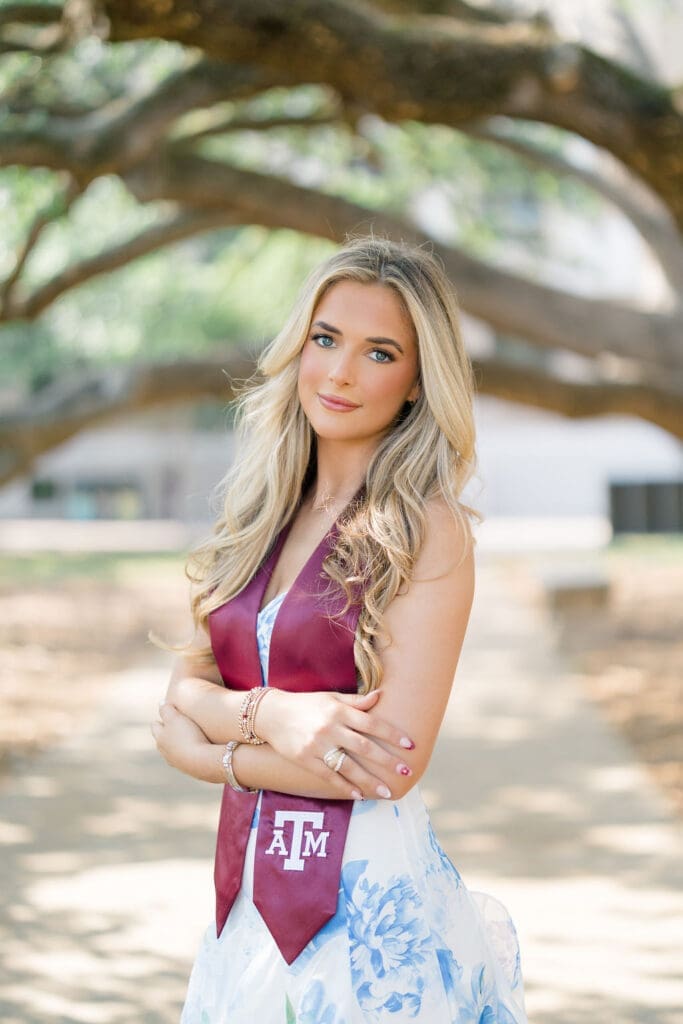 Graduation photo at the Century Tree on Texas A&M campus