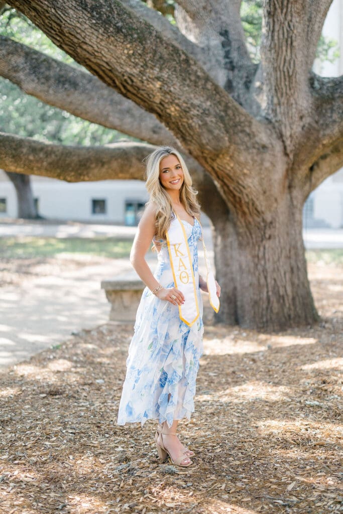 Graduation photo at the Century Tree on Texas A&M campus